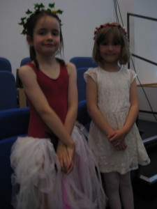 Feeling proud (and a little camera shy) after a great performance: Heather and Madeleine, two of the Wood Nymphs